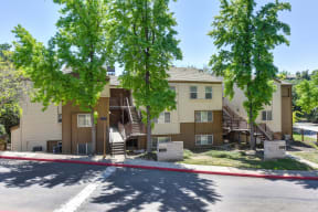 Community Outdoor Green Space with Street, Trees and Apartment Exteriors at Folsom Ranch, Folsom, 95630