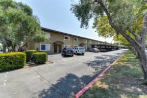 Community Exterior with Parking Lot  at Olympus Park Apartments, California, 95661