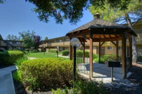 Outdoor Space with Gazebo, Grass and Tress  at Olympus Park Apartments, Roseville, California