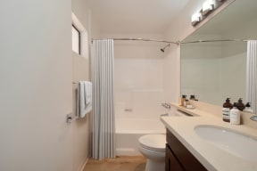 a bathroom with a shower toilet and sink at Croft Plaza Apartments, West Hollywood, 90069