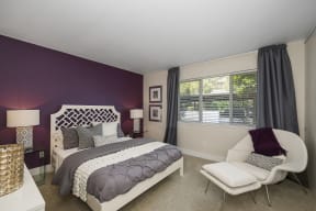 a bedroom with a purple accent wall and a white bed at Folsom Ranch, Folsom, 95630