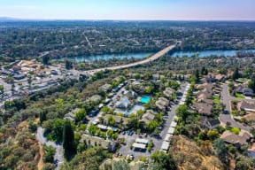 Drone View of Community showcasing the area above the complex and the river/town of Folsom in the distance.at Folsom Ranch, California, 95630