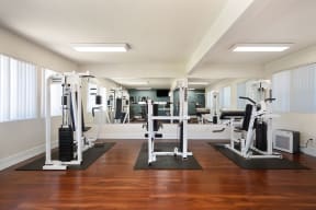 a workout room with a variety of exercise equipment