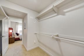 our apartments have huge extended closets with a door to the bedroom.