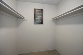 a room with two shelves and a sign on the wall