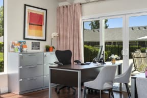 a home office with sliding glass doors to a patio