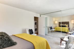a bedroom with a bed and a mirrored closet doors at The Retreat at Walnut Creek, Walnut Creek, California