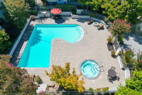 An aerial view of the Retreat swimming pool and spa area with lounge options.
