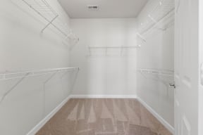 a spacious walk in closet offers lots of room for extra storage