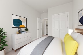 a bedroom with white walls and a white bed with a yellow pillow