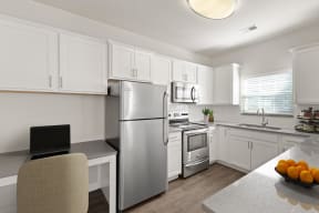 Stainless Steel Appliances and updated fixtures in kitchen