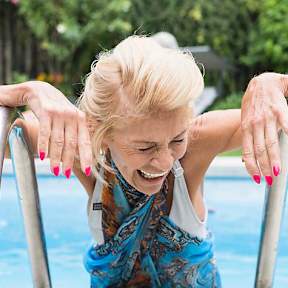 Woman enjoys an outdoor pool