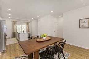 Open dining room with kitchen view at The Courts at Maverick Yards Apartments, South Carolina
