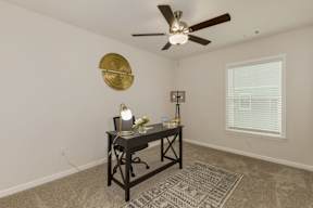 Home office with desk and decorative wall art at The Courts at Maverick Yards Apartments, South Carolina, 29662