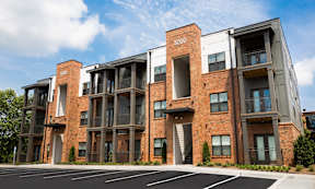 Cotton Mill Apartments exterior three-story apartments with brick walls