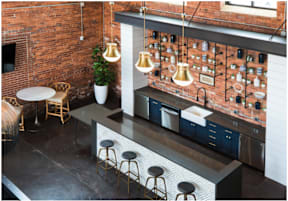 Cotton Mill Apartments clubhouse with kitchen island and four stools.