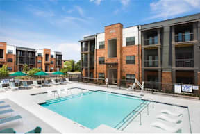 Cotton Mill Apartments pool with lounge chairs