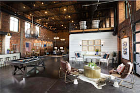 Cotton Mill Apartments clubhouse with pool table and chairs