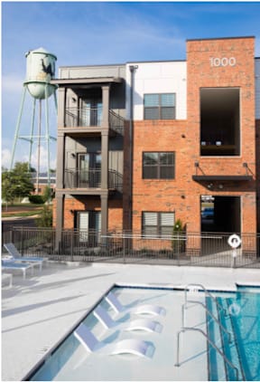 Cotton Mill Apartments pool with lounge chairs