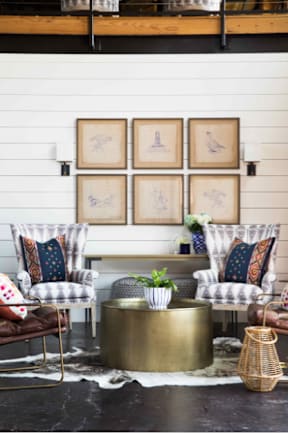 Cotton Mill Apartments clubhouse with a coffee table and chairs.