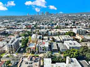 A cityscape with buildings and a clear sky.