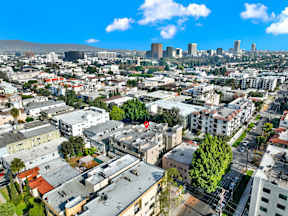 A cityscape with buildings and a clear sky.