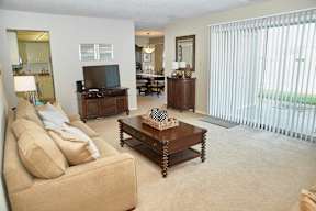 Classic Series Living Room at Somerset Lakes with Patio Access