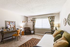 Secondary bedroom in a signature series 2-bed, 2-bath apartment at Somerset Lakes, featuring ample space and natural light.