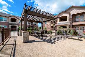 Outdoor pergola and resident seating area at Timber Creek Apartments
