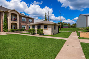 A residential area with houses and a clear sky.