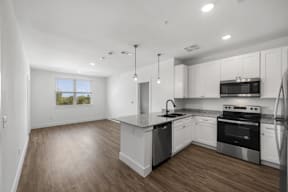 Kitchen and living room at Flat Creek Apartments in Athens Texas