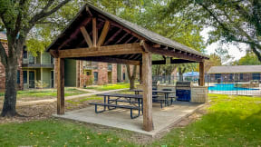 a picnic area with a picnic table in a park