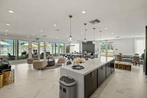 A modern kitchen with a marble countertop and a large island.