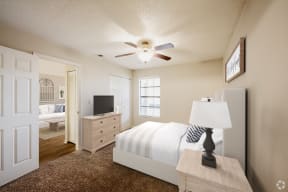 a bedroom with a white bed and a ceiling fan at Lakeside Gardens, Florida, 32114