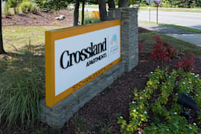 A sign for Crossland Apartments in St. Charles.