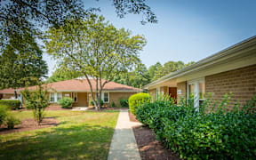 A residential area with houses and greenery.