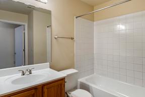 a bathroom with a sink toilet and bathtub