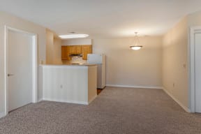 Carpeted Living Room Connected to Breakfast Bar off of Kitchen