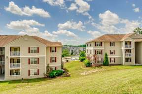 Apartment Building Exterior with Grassy Courtyard