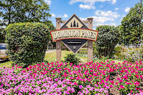 Property sign with flowers in front