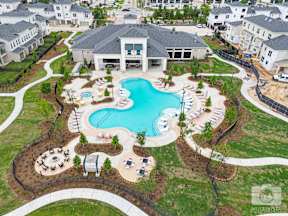 A large house with a pool in the backyard.