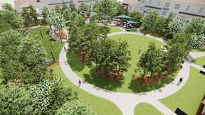 A park with a circular walking path and trees.