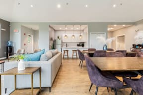 Eagle Creek Apartments resident lounge featuring a seating area, dining area, and kitchen