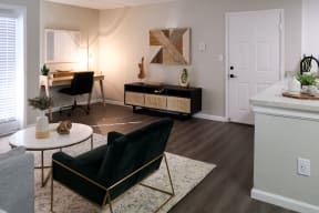 spacious living space with a seating area, office area, and tv console
