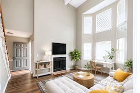 A living room with a fireplace and a couch.