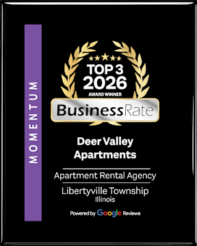 A black and gold award sign for Deer Valley Apartments.