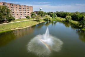 pond with a water feature outside the Willow Crossing apartment building in Elk Grove Village