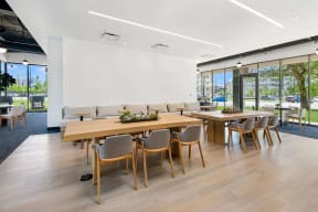 long tables with seating for co-working at Atrio Apartments