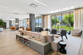 a large living room with furniture and large windows