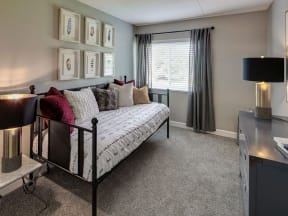 a daybed in a carpeted bedroom of a Elk Grove Village apartment